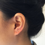 Model wearing Short U-shape wire Earrings with double post in - rose gold 