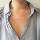 Model wearing Yellow Gold Wire Bar and Chain drop Necklace