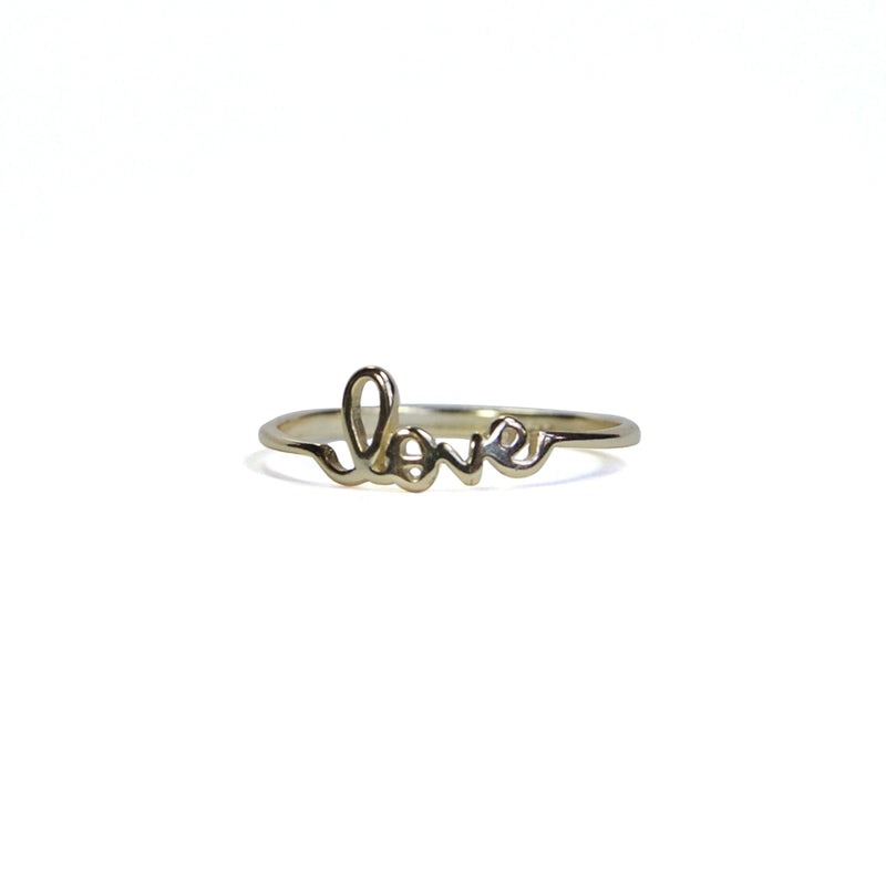 Yellow gold lover letter ring at an alternate angle